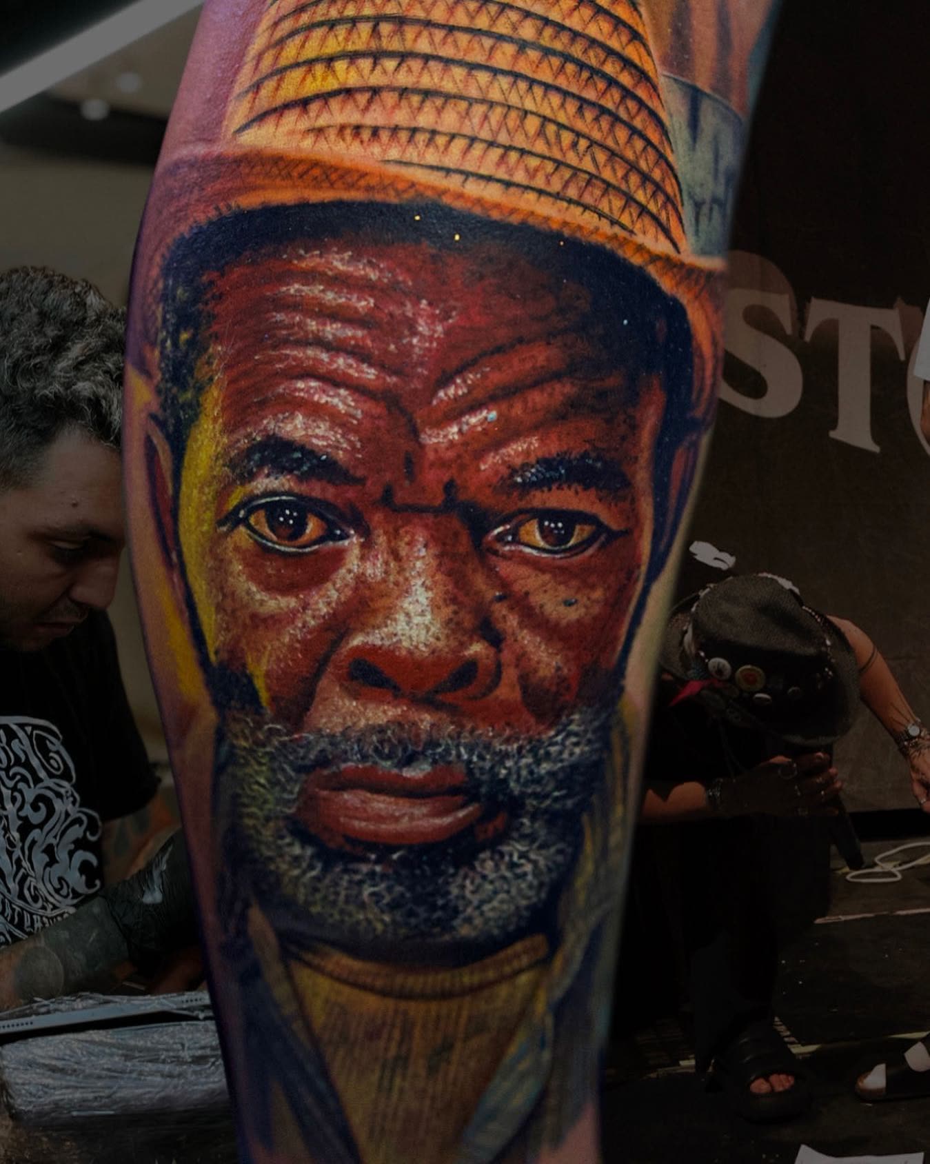 Color portrait tattoo of elder in hat by Christian Silva