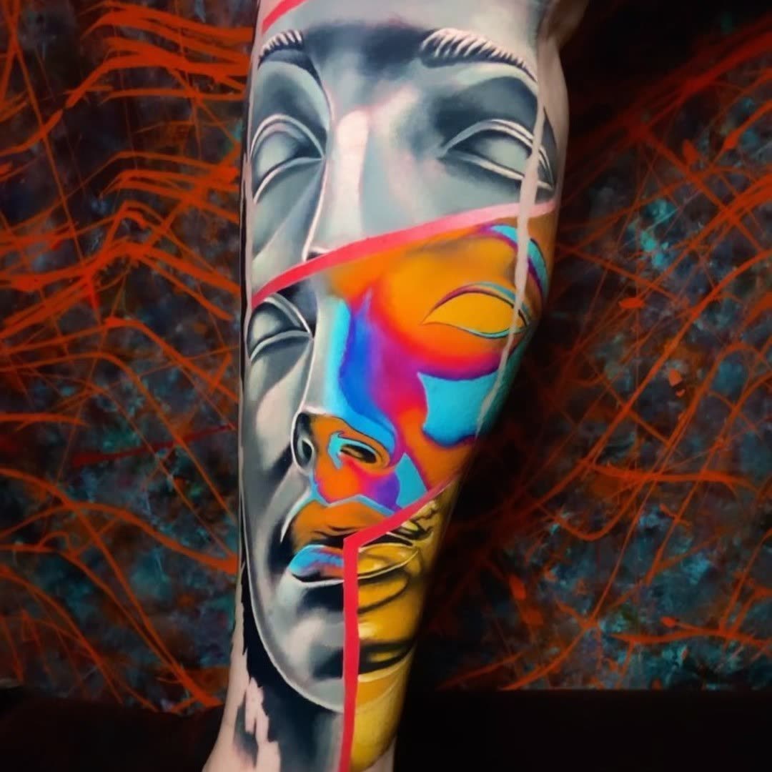 Fractured face duality tattoo by Christian Silva